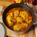 Top view of Staub dutch oven with Pavo Guisado in it