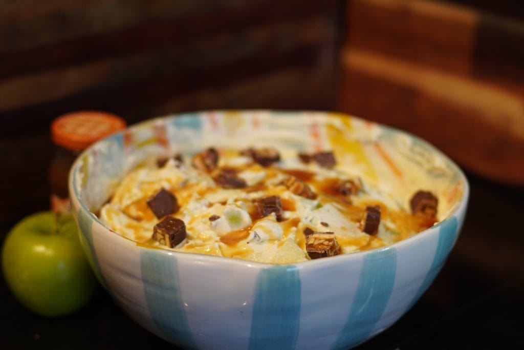 apple snickers salad served in a bowl