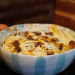apple snickers salad served in a bowl