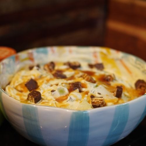apple snickers salad served in a bowl