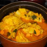 Puerto Rican Chuletas guisadas in an Orange dutch oven